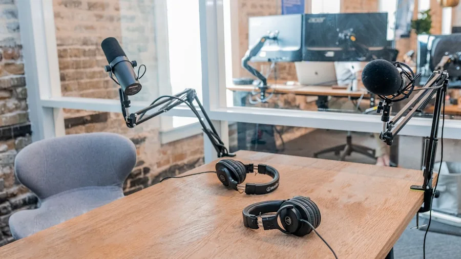 Multiple people sitting at a table recording a podcast interview with microphones