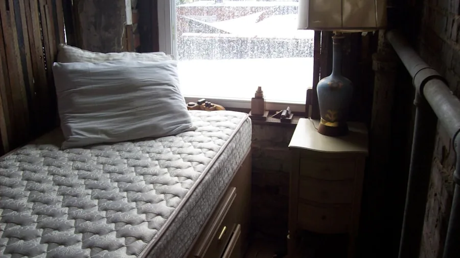 Neatly made bed with comforter properly fitted and draped evenly on all sides