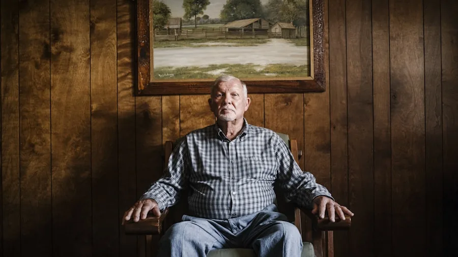Older adult sitting comfortably on a chair, demonstrating proper ergonomic seating height and posture