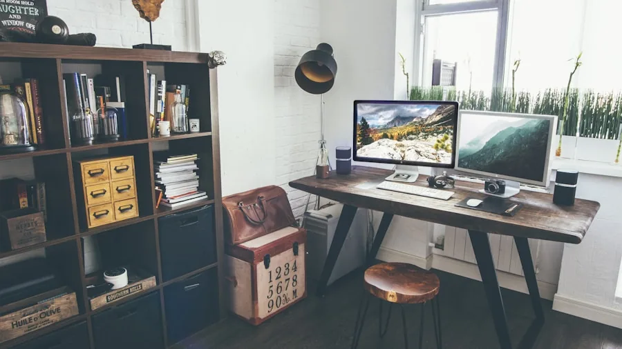 Organized desk workspace with laptop, keyboard, and notepad showing proper ergonomic setup