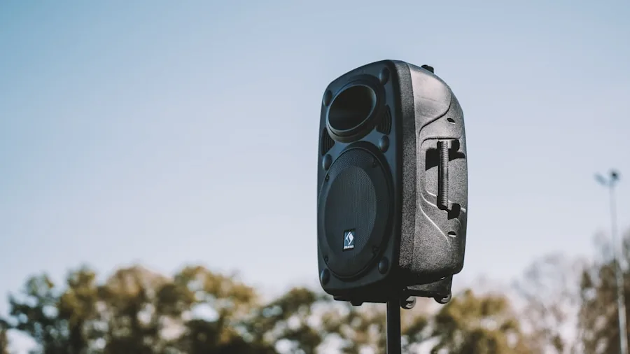 Outdoor speaker weathering heavy rain in natural backyard setting