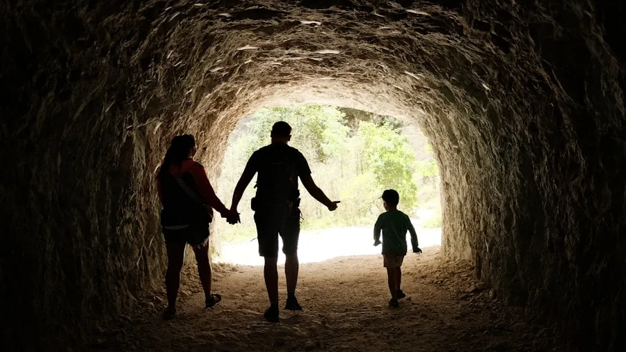 Parent and child exploring outdoors during family travel adventure
