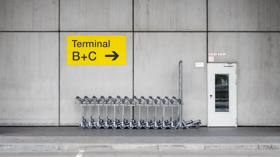 Parent folding compact stroller at airport gate for travel with child