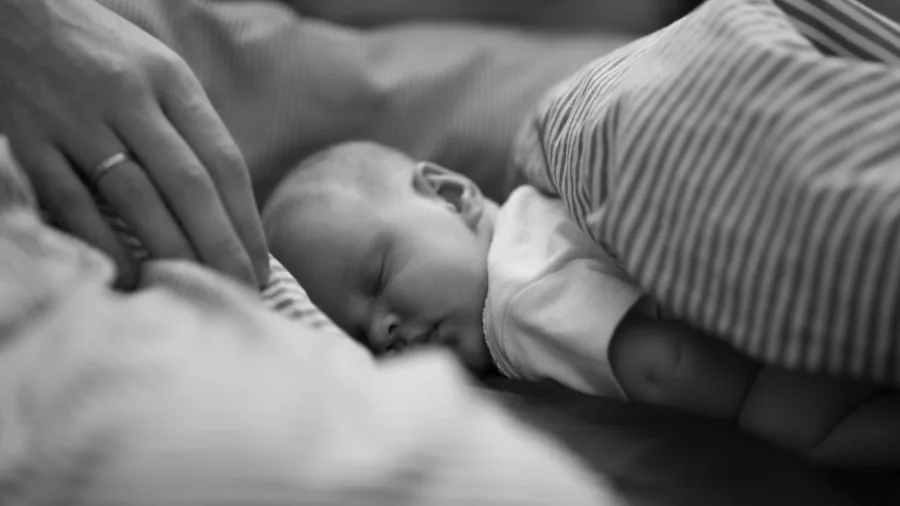 The %product_count% Best Baby Monitors 4 Parent monitoring sleeping infant in dark nursery room at night
