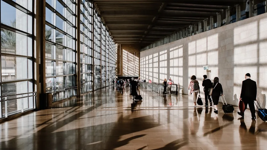 Parent navigating busy airport terminal with lightweight stroller, showing real travel with child