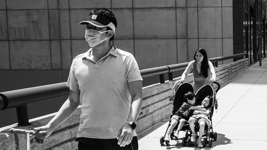 Parent pushing double stroller on urban sidewalk with child, demonstrating everyday stroller use and durability