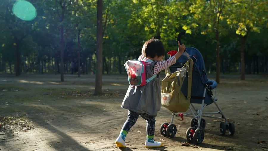 Parent pushing double stroller with two young children on a sunny outdoor path