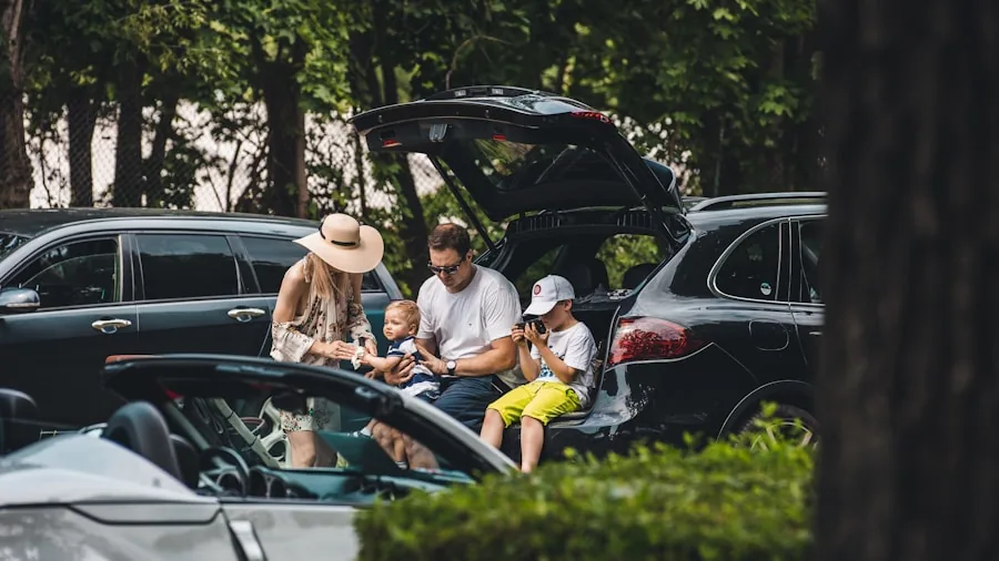 Parent securing child in car seat, focusing on safety features and proper installation during family travel