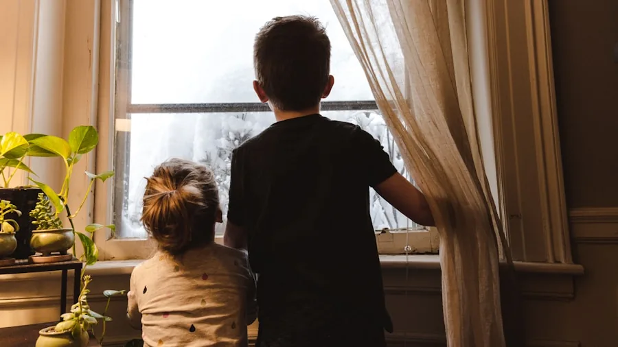 Parent supervising child in modern home kitchen, emphasizing family safety and home security
