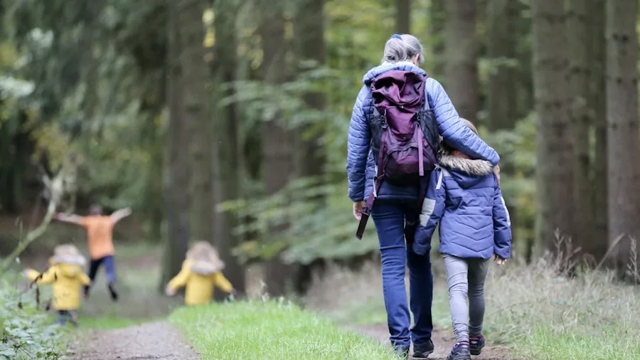 Parent wearing backpack while carrying baby outdoors, demonstrating comfortable weight distribution and posture