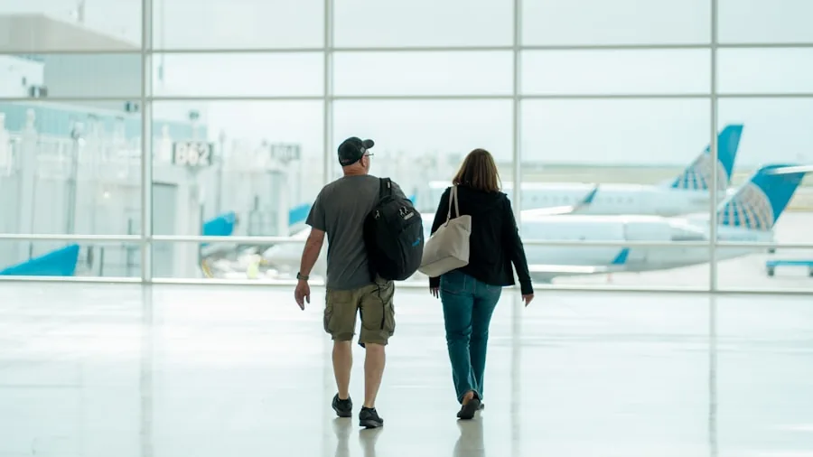 Parent with child navigating through airport terminal with luggage and travel essentials