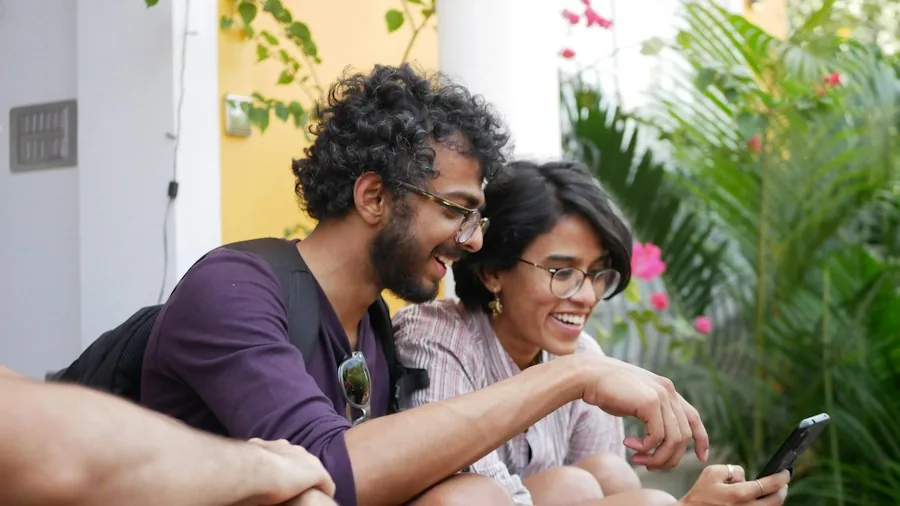 parents reviewing mobile app on smartphone