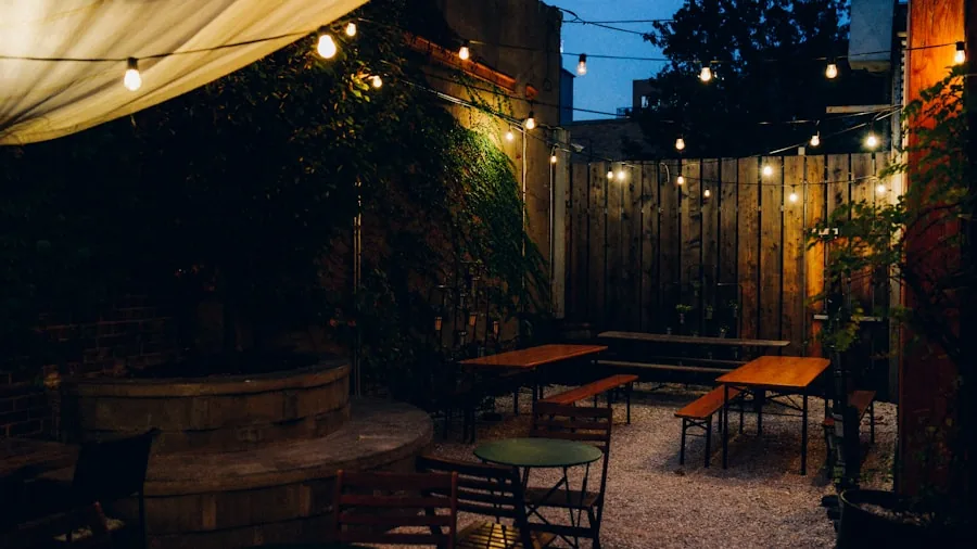 People enjoying conversation on a backyard patio during golden hour with natural outdoor ambiance
