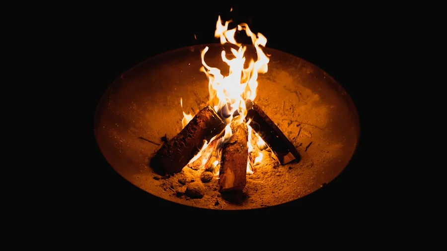 The %product_count% Best Smokeless Fire Pits 4 People grilling food over a smokeless fire pit with cooking grates in a backyard setting