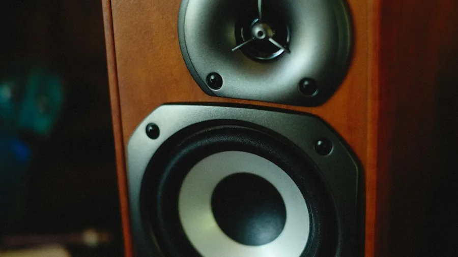 Speaker Height Mistakes That Damage Your Home Theater Sound and How to Fix Them 2 person adjusting bookshelf speakers listening position