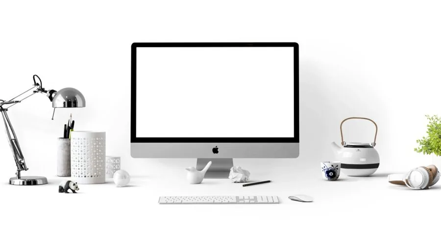 The %product_count% Best Curved Monitors 5 Person adjusting curved monitor height at desk for proper ergonomic positioning during work