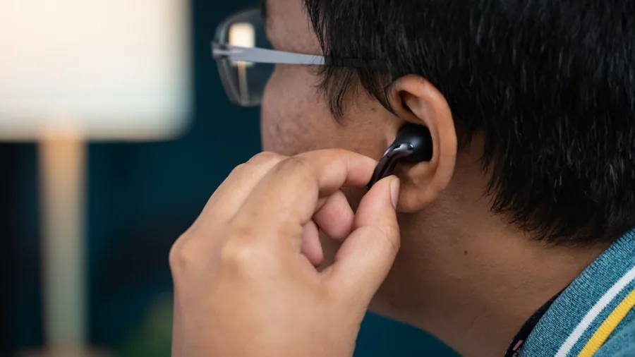 Cheap Earbud Upgrade Can Dramatically Improve Sound Quality and Comfort 3 person adjusting earbuds comfortable fit