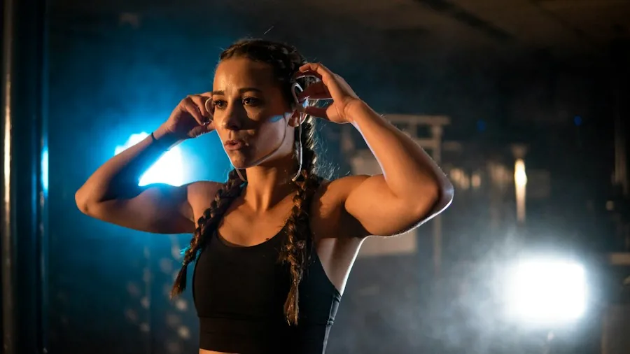 Apple AirPods 5 Launch: What Shoppers Should Know About the Pricing Shake-Up 3 person adjusting earbuds while exercising
