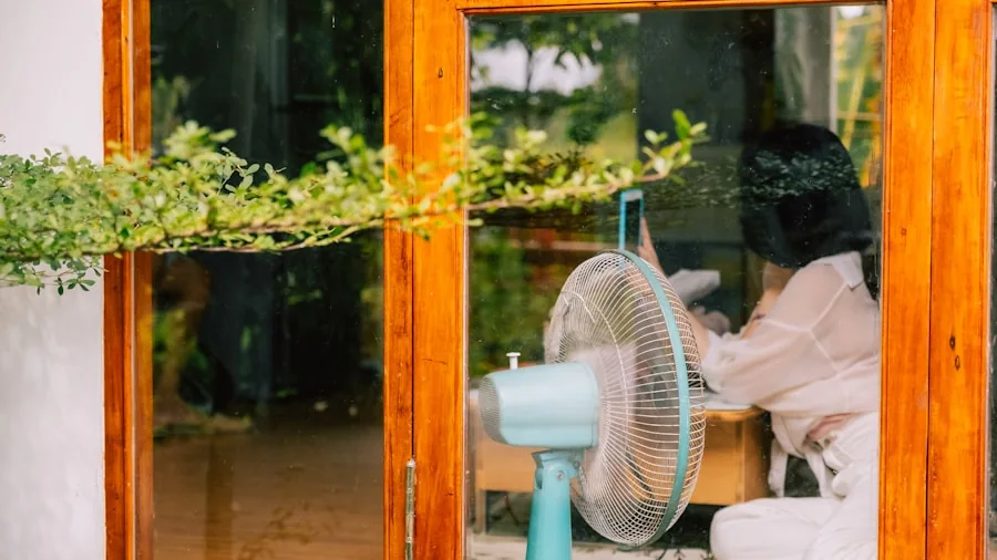 Person adjusting home fan settings to reduce energy consumption and lower electricity bills