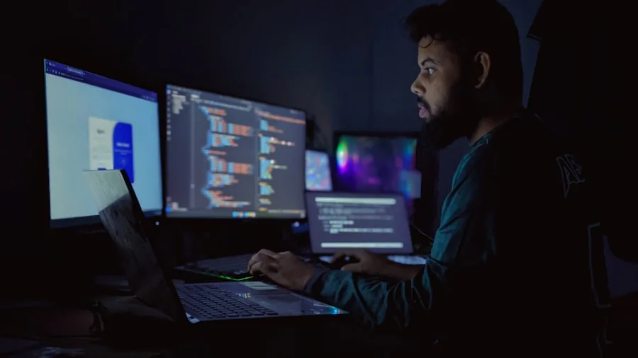 Person assembling computer components at desk with focused concentration