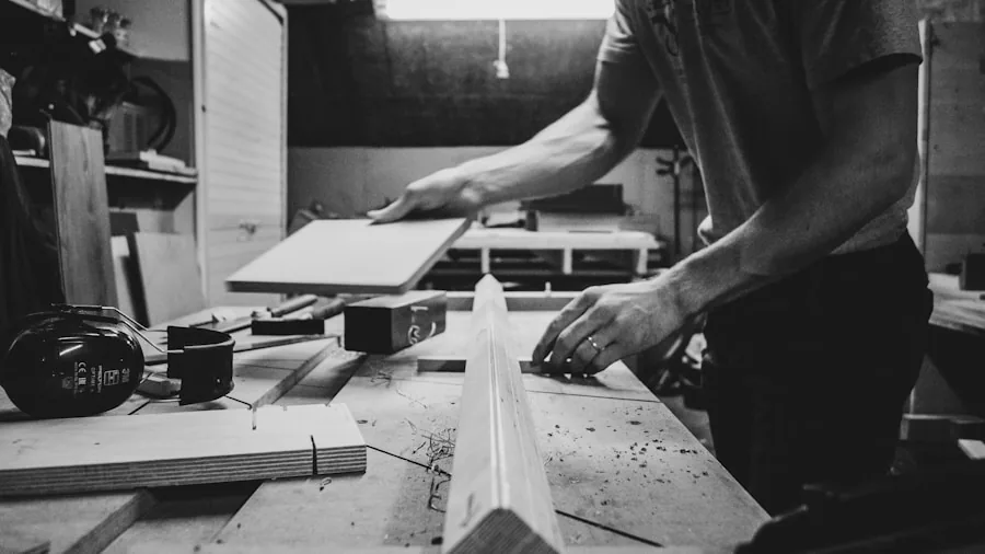 Person assembling flat-pack furniture at home with screwdriver and hardware
