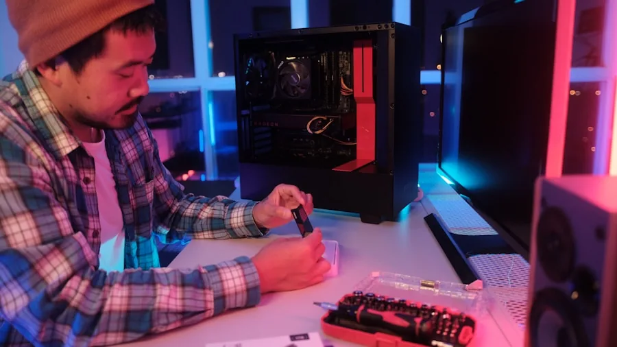 Person assembling internal PC components at desk with organized workspace and tools