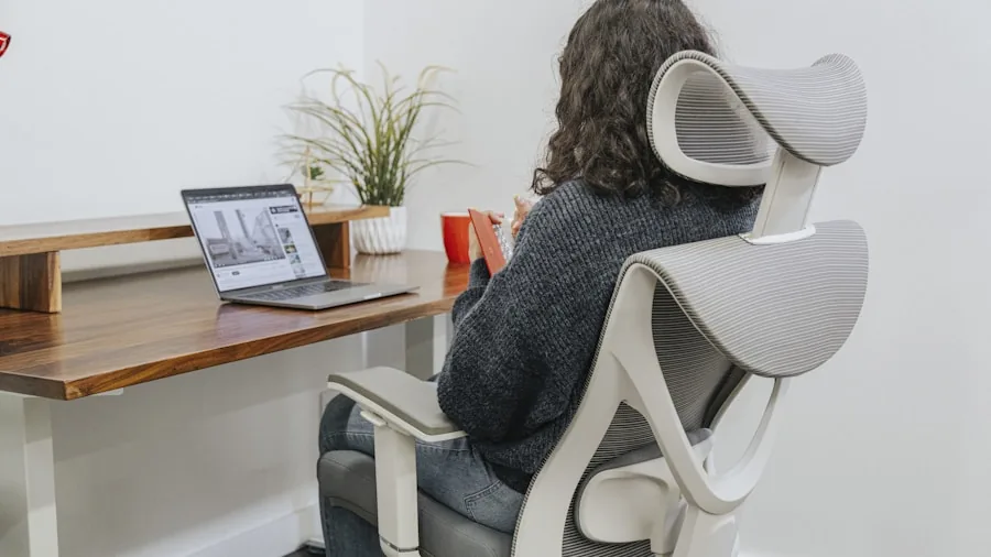 Person at desk demonstrating proper hand and wrist posture during computer work
