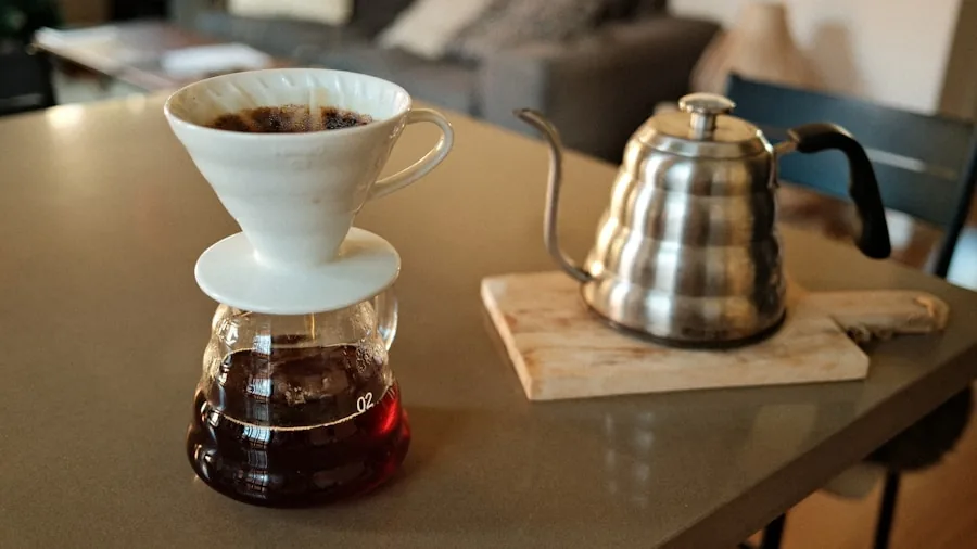 Person brewing fresh ground coffee in a home kitchen during morning routine
