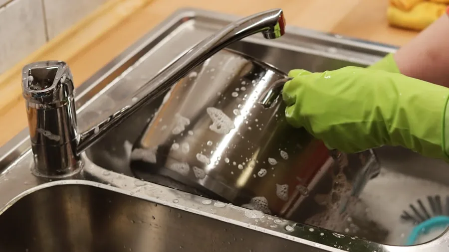 The %product_count% Best Steak Knives 4 Person carefully hand washing a steak knife under running water at a kitchen sink
