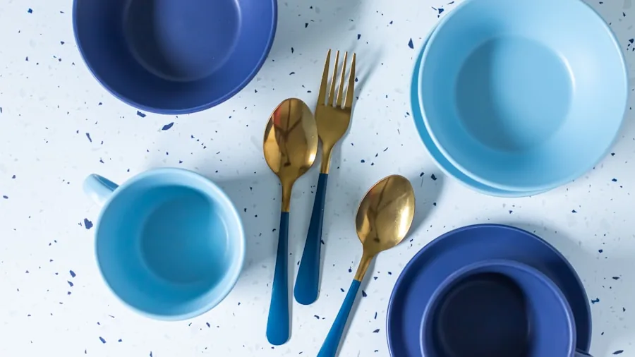 Person carefully handling ceramic dishes during everyday meal preparation in a home kitchen