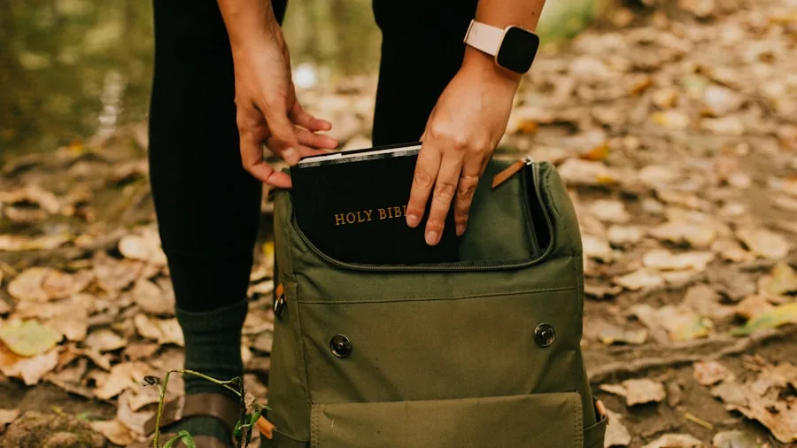 The %product_count% Best Travel Backpacks 4 Person carefully placing laptop into padded backpack compartment during travel