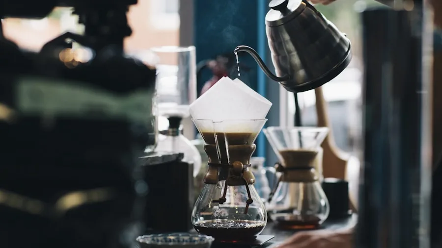 The %product_count% Best Drip Coffee Makers 3 Person carefully pouring hot water into coffee maker during morning brewing routine