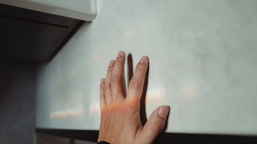 Person carefully using kitchen equipment with proper technique and safety awareness
