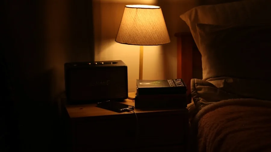 The 12 Best Table Lamps 4 Person charging multiple devices on a modern nightstand with lamp in bedroom morning light