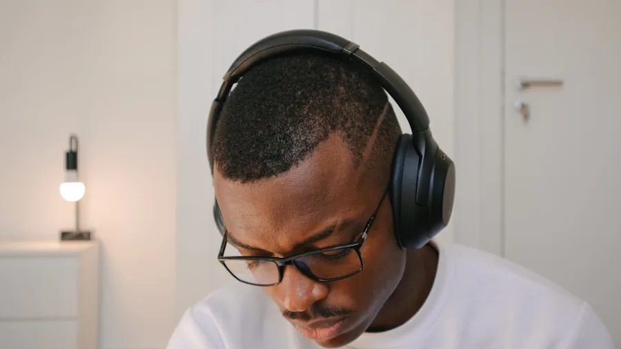 The %product_count% Best Noise Cancelling Headphones 3 Person charging wireless headphones while working at desk with laptop
