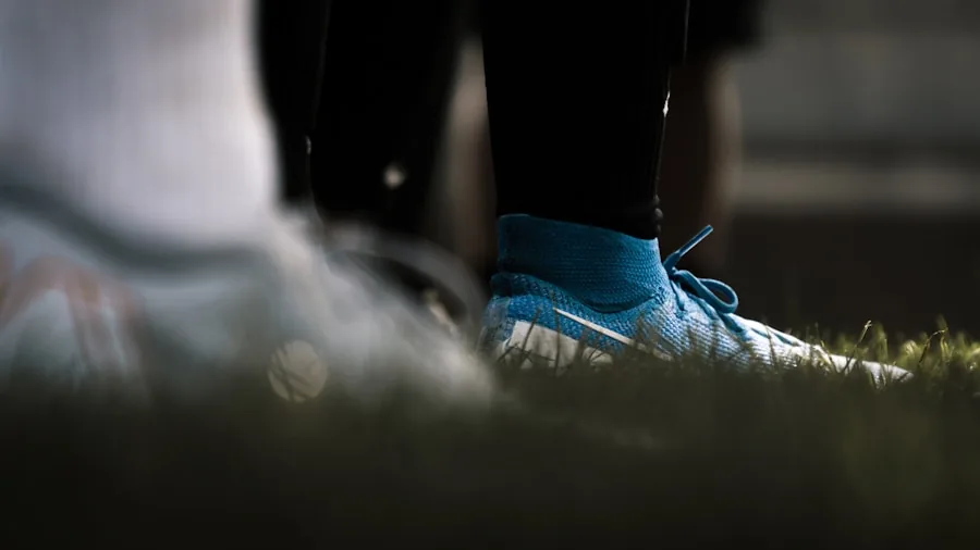 The %product_count% Best Soccer Cleats 5 Person checking fit of athletic soccer cleats on foot indoors