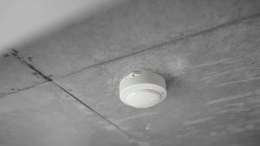 Person checking safety equipment in home garage with protective awareness