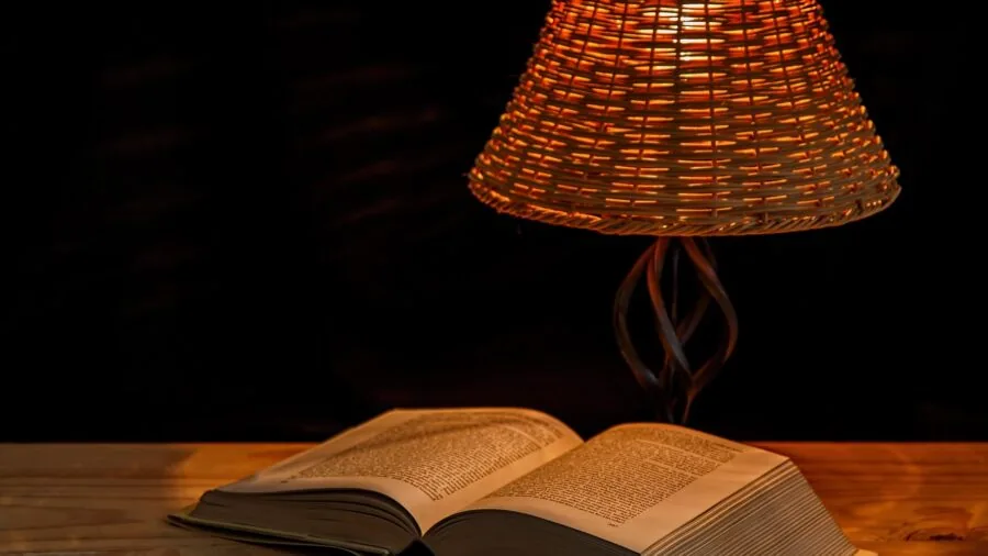 The 9 Best Alarm Clocks 2 Person checking time on bedside alarm clock in dark bedroom at night
