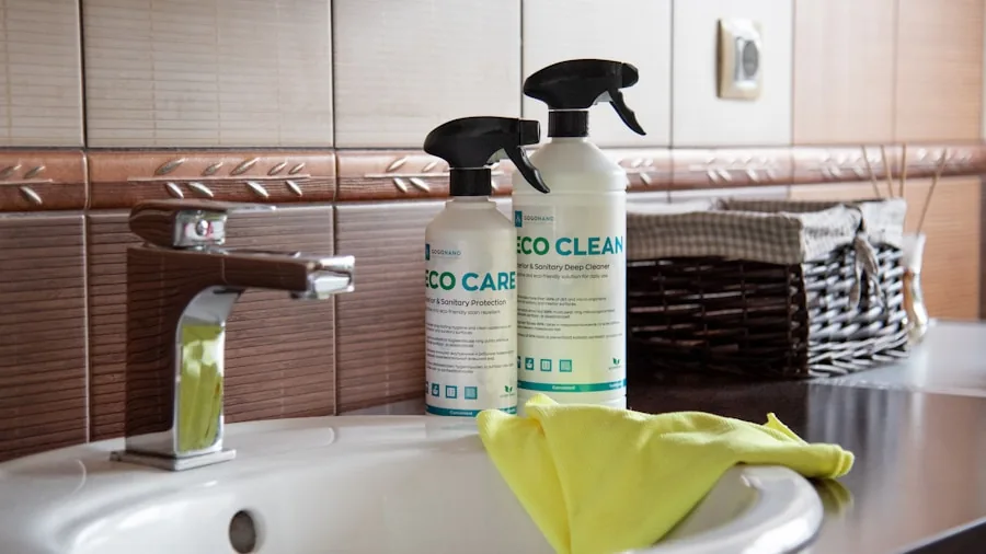 Person cleaning bathroom sink with cloth and spray bottle in bright modern bathroom
