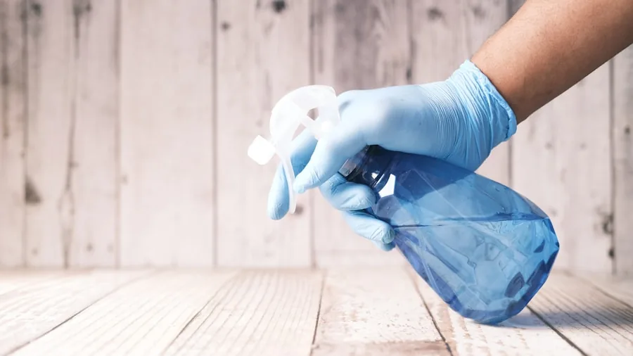 SharkNinja AquaReach Launches New Wet Dry Vacuum with Extended Reach What Shoppers Should Know 2 person cleaning cabinet spray wand