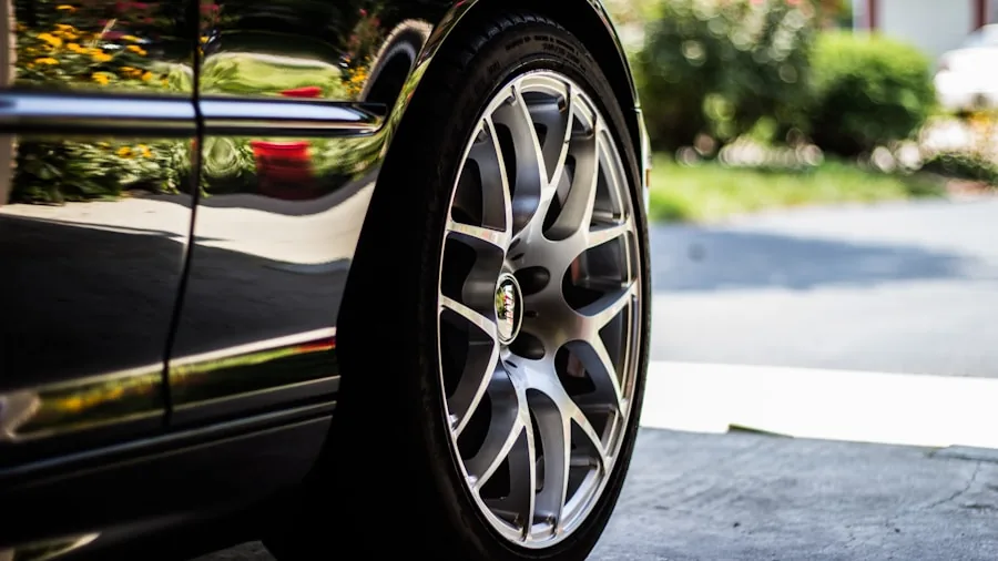 The %product_count% Best Tire Cleaners 4 Person cleaning car tire with brush and cleaner product during vehicle maintenance