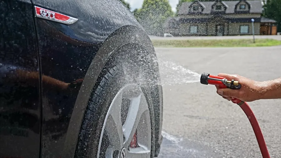 The %product_count% Best Tire Cleaners 3 Person cleaning dirty car wheel and tire with brush and cleaning solution outdoors