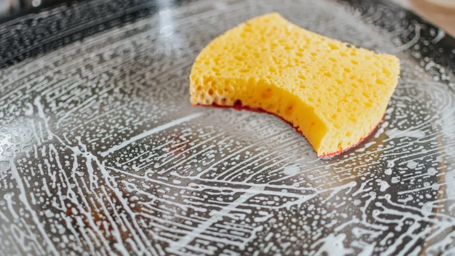 The %product_count% Best Toasters 4 Person cleaning out toaster crumb tray over trash bin in modern kitchen