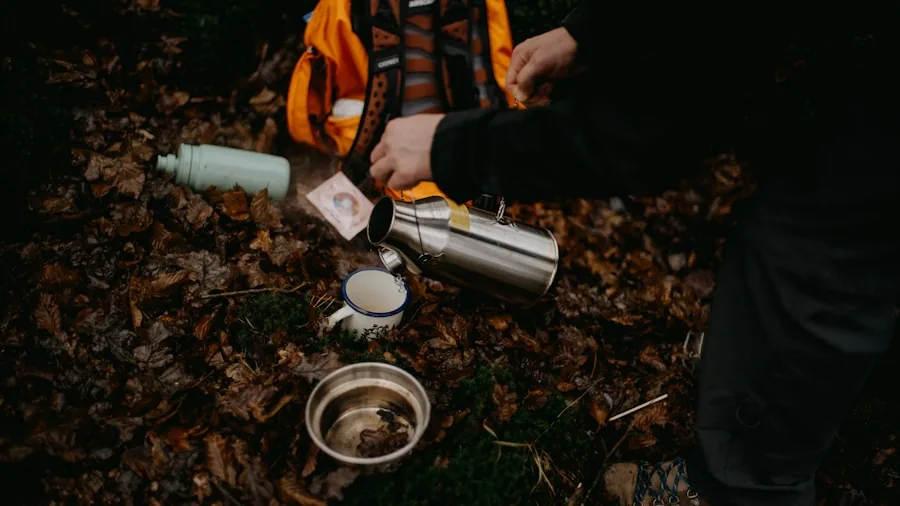 Person comparing different travel coffee mugs while planning a trip outdoors