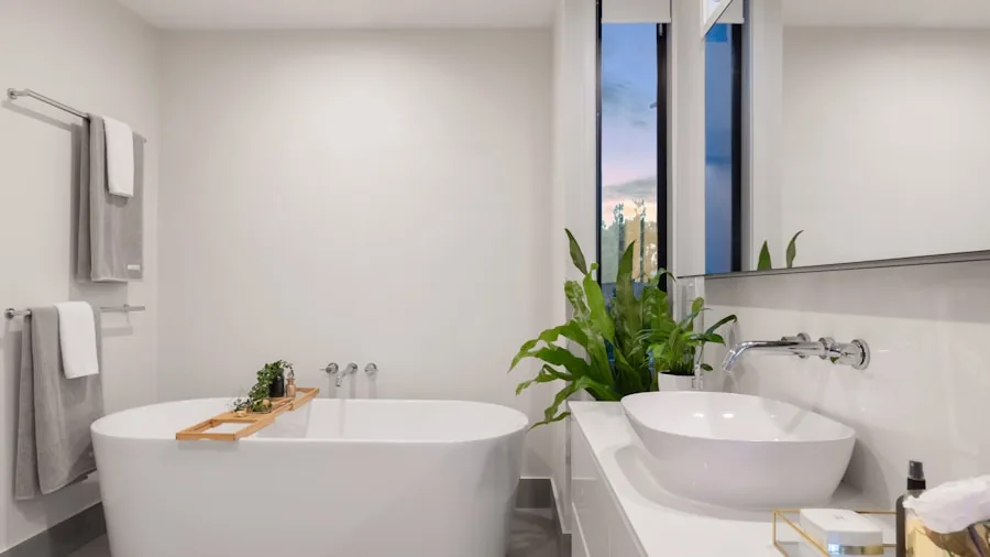 Person comparing prices and making notes while planning bathroom upgrade costs and value