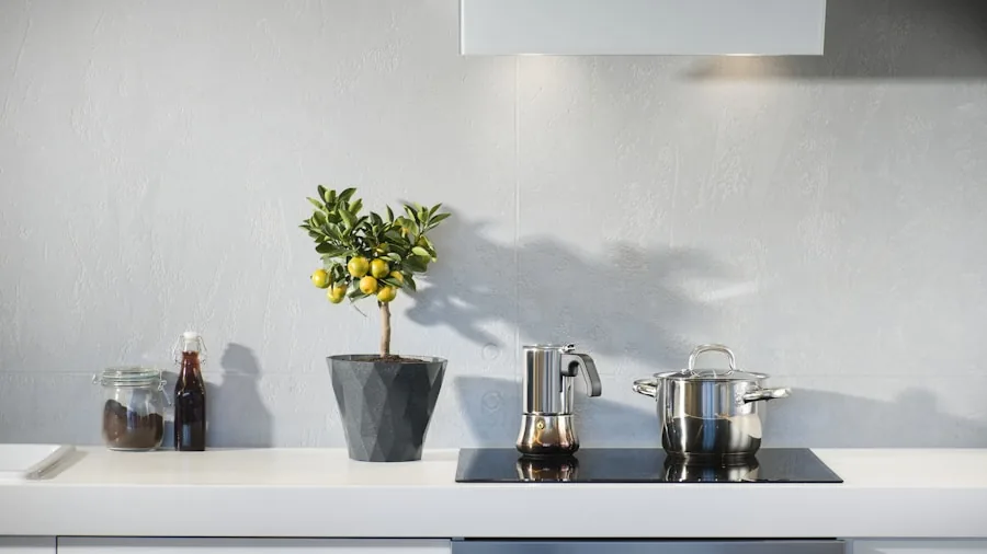 Person cooking with wok on modern induction cooktop in contemporary kitchen