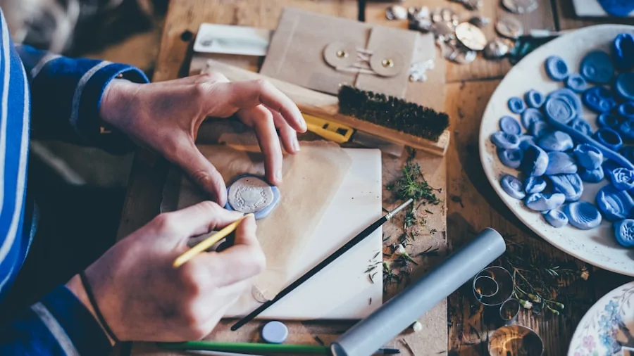 Person doing detailed craft work with focused hand positioning and ergonomic grip on workbench