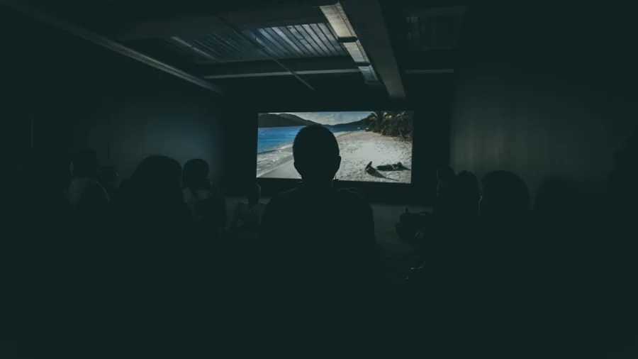 The %product_count% Best Samsung TVs 2 Person enjoying a movie in a dimly lit living room, experiencing high contrast picture quality