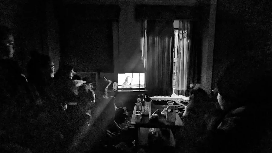 The %product_count% Best TVs 2 Person enjoying a movie in a dimly lit room, experiencing cinematic viewing