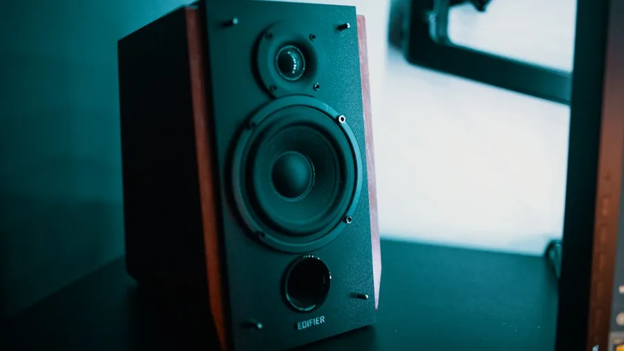 Person enjoying high quality audio from desktop speakers in a comfortable home environment